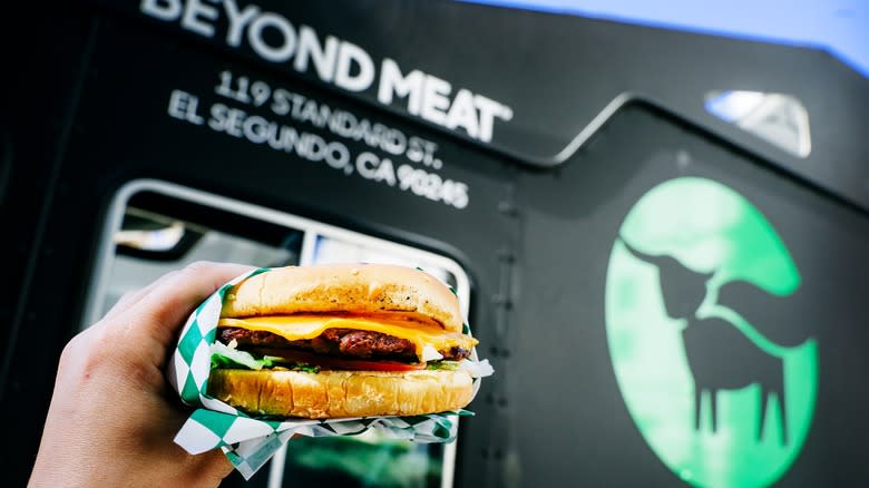 hand holding Beyond Meat burger