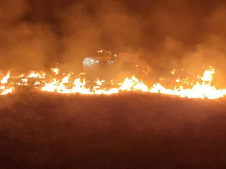 A truck drives along the fire line of the Cow Valley Fire burning in Eastern Oregon. (KOIN 6)