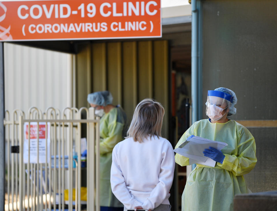 People wait outside the Tanunda War Memorial Hospital, a dedicated COVID-19 testing clinic to deal with the expected uptick in cases in the Barossa Valley. Source: AAP/David Mariuz