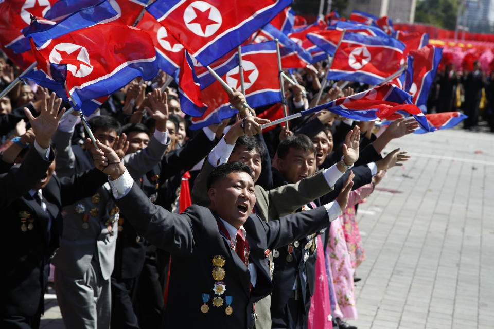 Participants cheer as they take part in a parade marking the 70th anniversary of North Korea's founding day in Pyongyang, North Korea, Sunday, Sept. 9, 2018. North Korea staged a major military parade, huge rallies and will revive its iconic mass games on Sunday to mark its 70th anniversary as a nation. (AP Photo/Ng Han Guan)