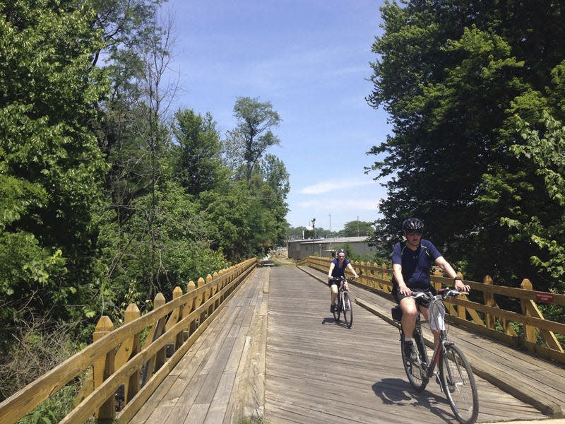 Bicyclists ride the Pumpkinvine Nature Trail in Middlebury. Joseph Dits, South Bend Tribune file
