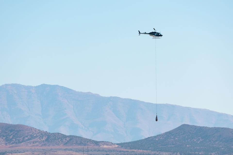 A helicopter long lines the capsule containing a sample collected from the Bennu asteroid as part of NASA’s Osiris-Rex mission and carries it to a clean room at the U.S. Army’s Dugway Proving Ground in Dugway on Sunday, Sept. 24, 2023. | Megan Nielsen, Deseret News