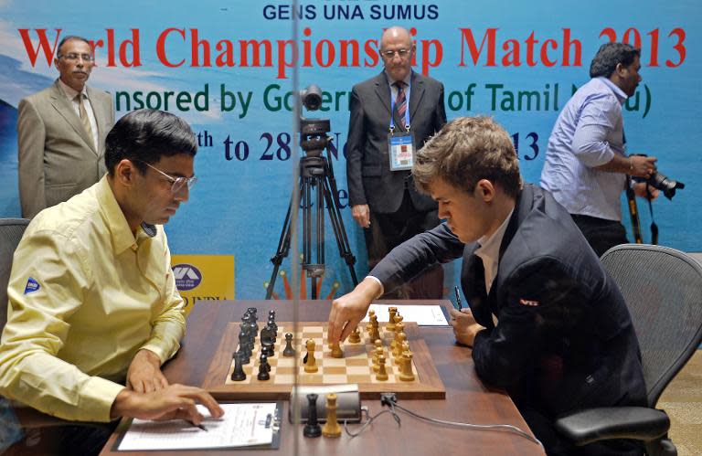Carlsen breaks Anand to win chess world title
