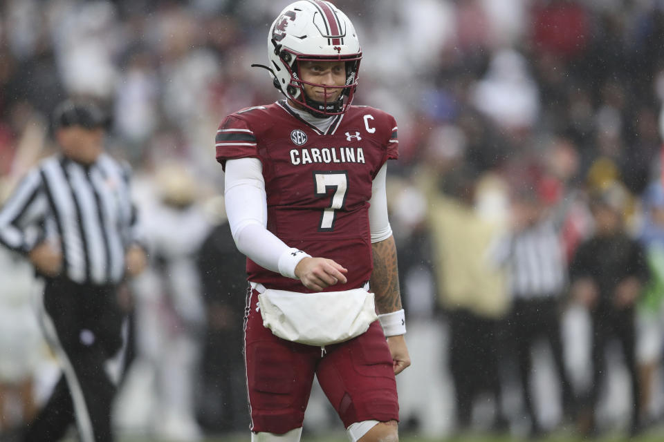 South Carolina quarterback Spencer Rattler (7) smiles as he leaves the field during the first half of an NCAA college football game against Vanderbilt on Saturday, Nov. 11, 2023, in Columbia, S.C. (AP Photo/Artie Walker Jr.)