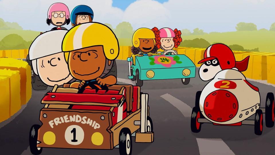 franklin and charlie brown race other kids in a homemade race car in a scene from welcome home franklin