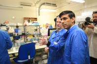 Chancellor Rishi Sunak is shown the testing of samples for respiratory viruses by Dr Antony Hale (left) during a visit to the pathology labs at Leeds General Infirmary. This is the same procedure that will be used by the lab when it begins to receive coronavirus samples for testing. (Photo by Danny Lawson/PA Images via Getty Images)