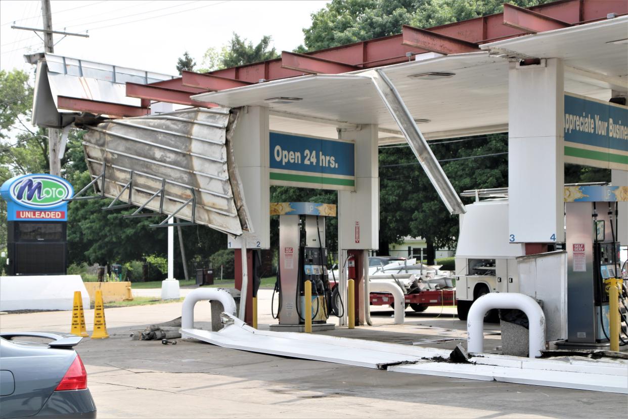 The awning over the gasoline pumps at the MotoMart, 1297 S. Prospect St. in Marion, partially collapsed during the heavy storm that swept through the region on Monday, June 13, 2022. Downed power lines and fallen trees and tree limbs were reported throughout Marion County in the wake of the storm.