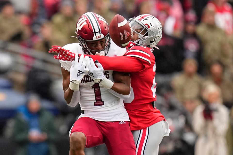 Nov 12, 2022; Columbus, Ohio, USA;  Ohio State Buckeyes cornerback Cameron Brown (26) breaks up a pass intended for Indiana Hoosiers wide receiver Donaven McCulley (1) during the second half of the NCAA football game at Ohio Stadium. Ohio State won 56-14. Mandatory Credit: Adam Cairns-The Columbus Dispatch