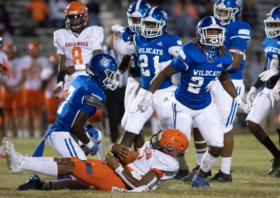 Eldrick Robinson II (24) celebrates after a big stop during the Escambia vs Washington football game at Booker T. Washington High School in Pensacola on Friday, Oct. 2, 2020.