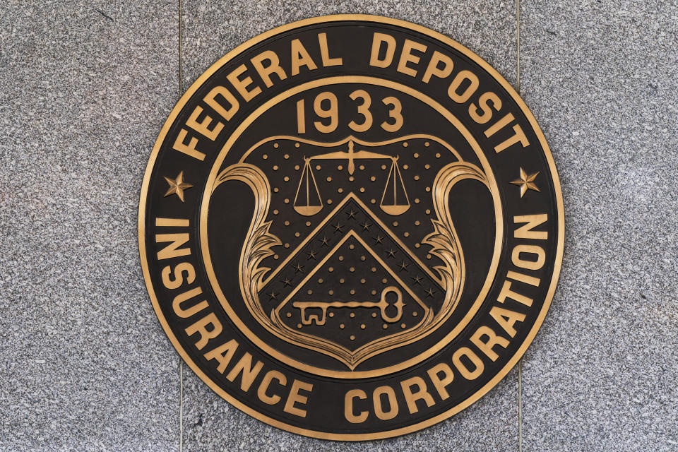 The Federal Deposit Insurance Corporation (FDIC) seal is shown outside its headquarters, Tuesday, March 14, 2023. Depositors withdrew savings, and investors broadly sold off bank shares as the federal government raced to reassure Americans that the banking system is secure following two bank failures. (AP Photo/Manuel Balce Ceneta)