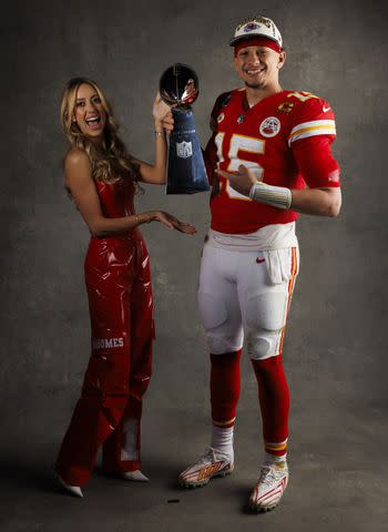 <p>Ryan Kang/Getty</p> Brittany and Patrick pose with the Vince Lombardi trophy