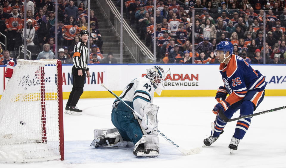 San Jose Sharks goalie James Reimer (47) is scored on by Edmonton Oilers' Darnell Nurse (25) during overtime in an NHL hockey game in Edmonton, Alberta, on Monday March 20, 2023. (Jason Franson/The Canadian Press via AP)