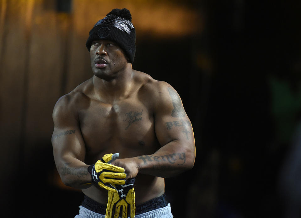 <p>Pittsburgh Steelers loinebacker James Harrison 92) takes the field without a shirt during warm-ups in recognition of teammate Ryan Shazier (not pictured) before playing the Baltimore Ravens at Heinz Field. Mandatory Credit: Philip G. Pavely-USA TODAY Sports </p>