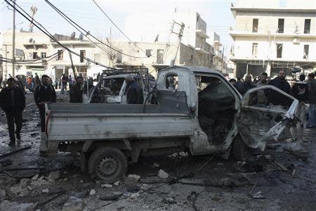 A damaged pick-up truck is pictured after what activists said was shelling by forces loyal to Syria's President Bashar al-Assad at a souk in Tariq Al Bab neighbourhood of Aleppo, December 28, 2013. REUTERS/Hosam Katan