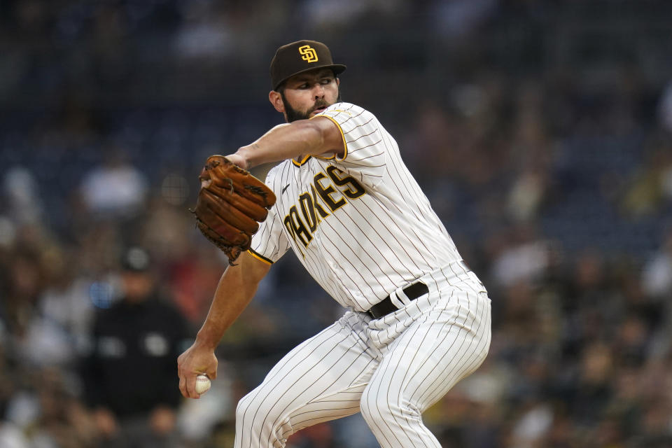 FILE - San Diego Padres starting pitcher Jake Arrieta works against a Houston Astros batter during the first inning of a baseball game Friday, Sept. 3, 2021, in San Diego. Arrieta, a key pitcher on the Chicago Cubs' 2016 World Series championship team, has decided to retire, in news announced Monday, April 18, 2022. (AP Photo/Gregory Bull, File)