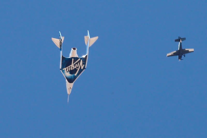 Virgin Galactic's passenger rocket plane VSS Unity descends after reaching the edge of space above Spaceport America