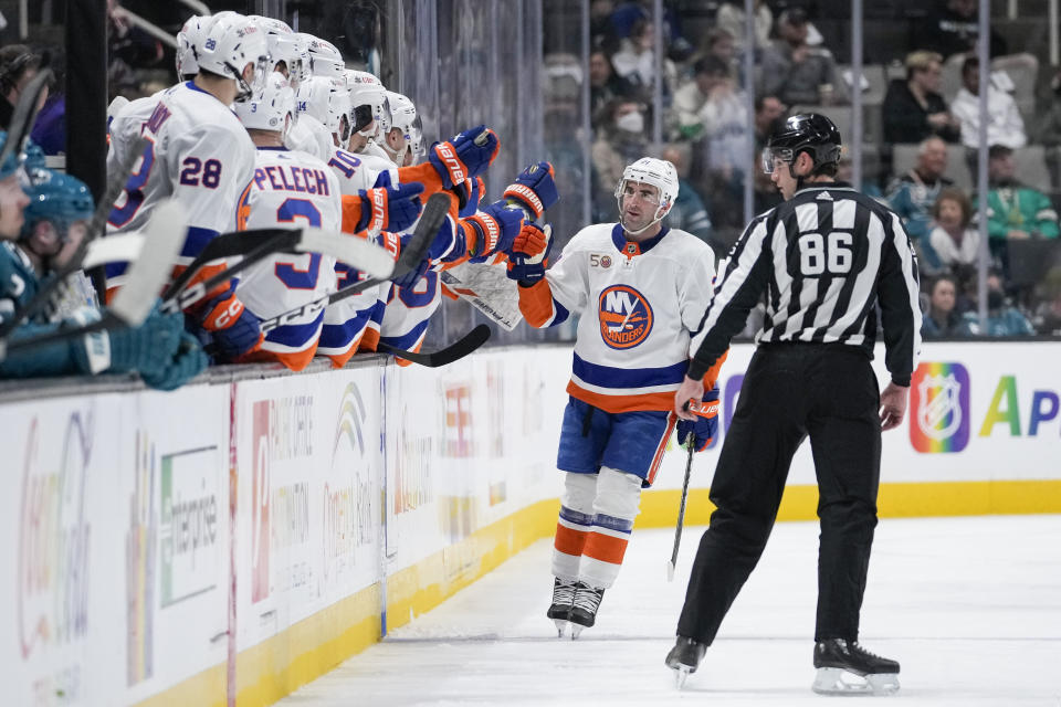New York Islanders center Kyle Palmieri is congratulated for his goal against the San Jose Sharks during the second period of an NHL hockey game in San Jose, Calif., Saturday, March 18, 2023. (AP Photo/Godofredo A. Vásquez)