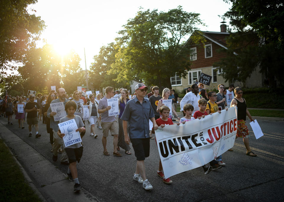 <p>People march from the site of Justine Damond’s shooting to Beard’s Plaissance Park during the “Peace and Justice March for Justine,” Thursday, July 20, 2017, in Minneapolis, Minn. (Photo: Aaron Lavinsky/Star Tribune via AP) </p>