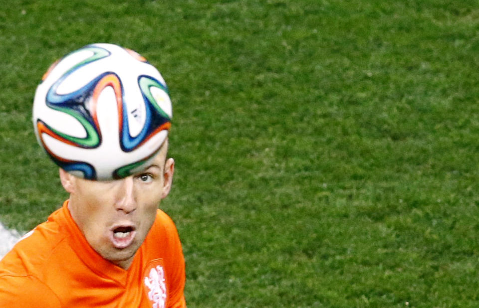 Arjen Robben of the Netherlands prepares to head the ball during the 2014 World Cup semi-finals between Argentina and the Netherlands at the Corinthians arena