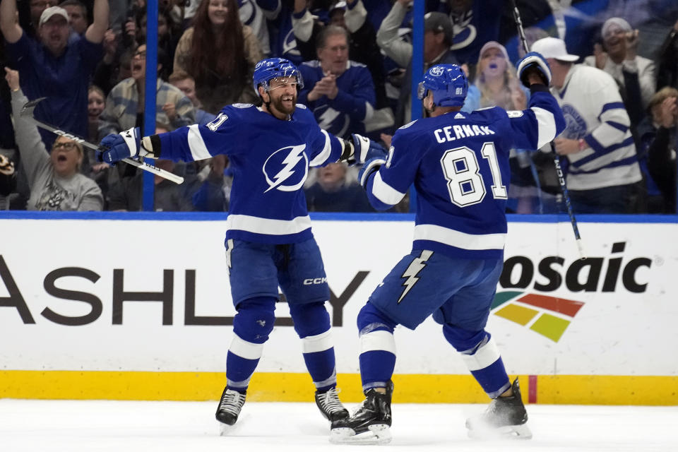 Tampa Bay Lightning center Luke Glendening (11) celebrates his short-handed goal against the New Jersey Devils with defenseman Erik Cernak (81) during the first period of an NHL hockey game Thursday, Jan. 11, 2024, in Tampa, Fla. (AP Photo/Chris O'Meara)