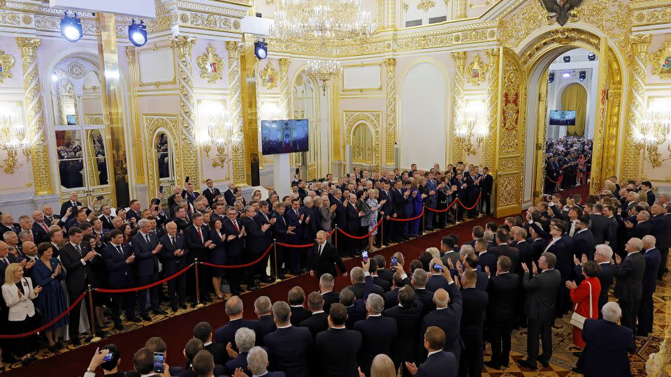 Attendees wait in the Kremlin as Putin arrives for his inauguration ceremony. - Maxim Shemetov/Reuters