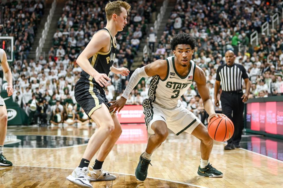 Michigan State's Jaden Akins, right, moves the bal against Purdue's Fletcher Loyer during the first half on Monday, Jan. 16, 2023, at the Breslin Center in East Lansing.