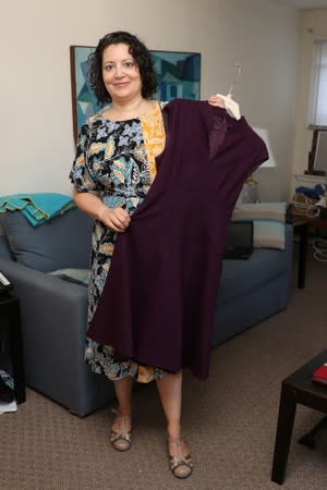 Lisa Batitto shows a dress she rented from a clothing rental site at her home in Montclair, New Jersey