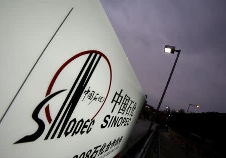 The Sinopec logo is seen outside one of its gas stations in Hong Kong April 26, 2010. REUTERS/Bobby Yip