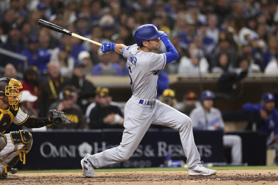 Los Angeles Dodgers' Trea Turner watch his two-RBI double in the eighth inning of a baseball game against the San Diego Padres, Saturday, April 23, 2022, in San Diego. (AP Photo/Derrick Tuskan)