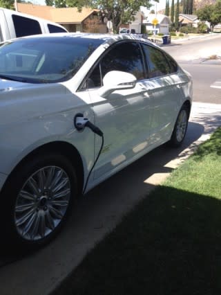 2014 Ford Fusion Energi charging in driveway [image provided by owner Brandt Buffham]