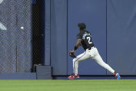 Miami Marlins center fielder Jazz Chisholm Jr. chases down a ball hit by Pittsburgh Pirates' Michael A. Taylor for a double, during the fourth inning of a baseball game, Friday, March 29, 2024, in Miami. (AP Photo/Wilfredo Lee)