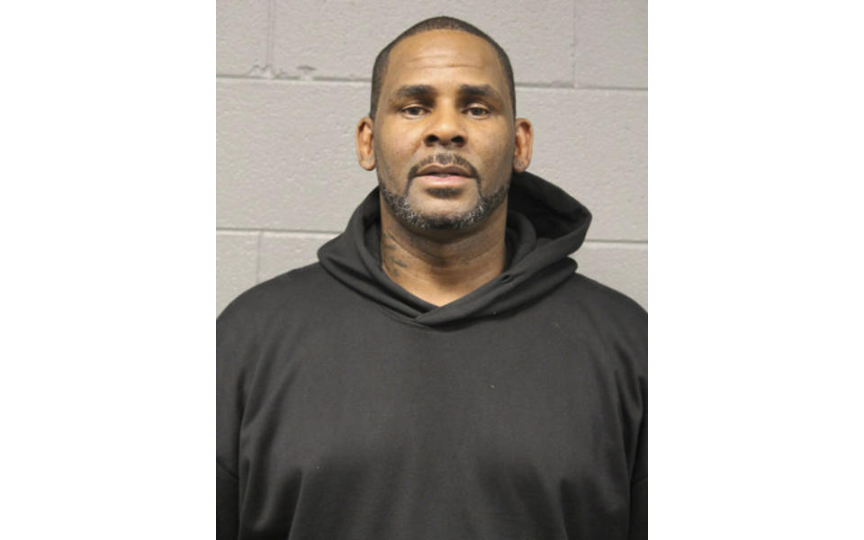 In this photo taken and released by the Chicago Police Dept., Friday, Feb. 22, 2019, singer R. Kelly is photographed during booking at a police station in Chicago, Il. R. Kelly, the R&B star who has been trailed for decades by allegations that he violated underage girls and women and held some as virtual slaves, is being charged with aggravated sexual abuse involving four victims, including at least three between the ages of 13 and 17. | AP