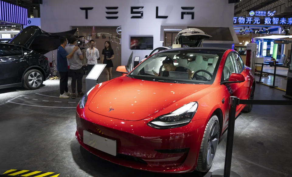 HAIKOU, CHINA - JULY 23: Exhibitors work at Tesla booth before the 2nd China International Consumer Products Expo at the Hainan International Convention and Exhibition Center on July 23, 2022 in Haikou, Hainan Province of China. (Photo by Yuan Chen/VCG via Getty Images)