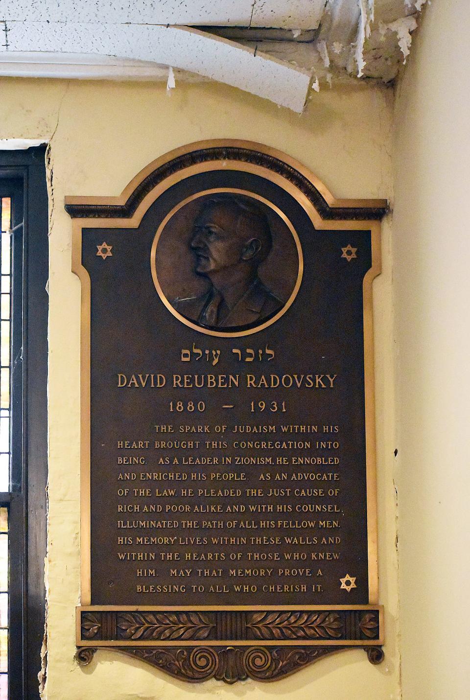 Water damage is visible at Temple Beth-El in Fall River, near a plaque dedicated to David Radovsky, the congregation's first president.