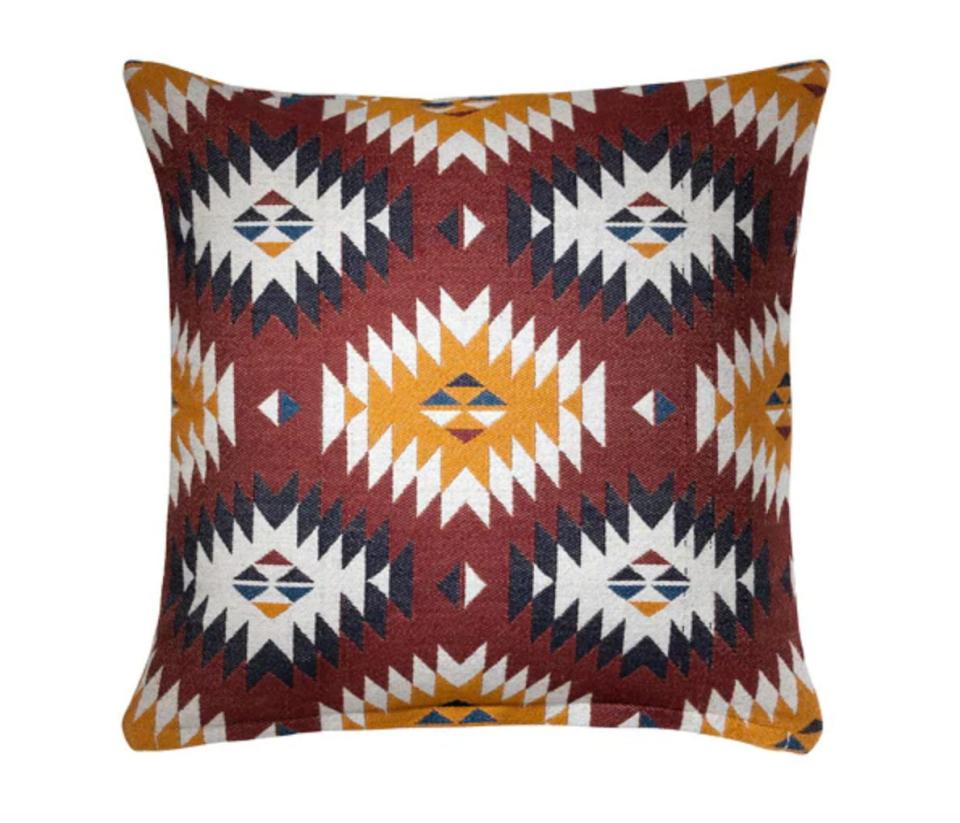 This 20 x 20 square wool-blend cushion cover is jacquard-woven with an earth-tone pattern. <strong><a href="https://fave.co/2NrcG3j" target="_blank" rel="noopener noreferrer">Find it for $15</a>.</strong>