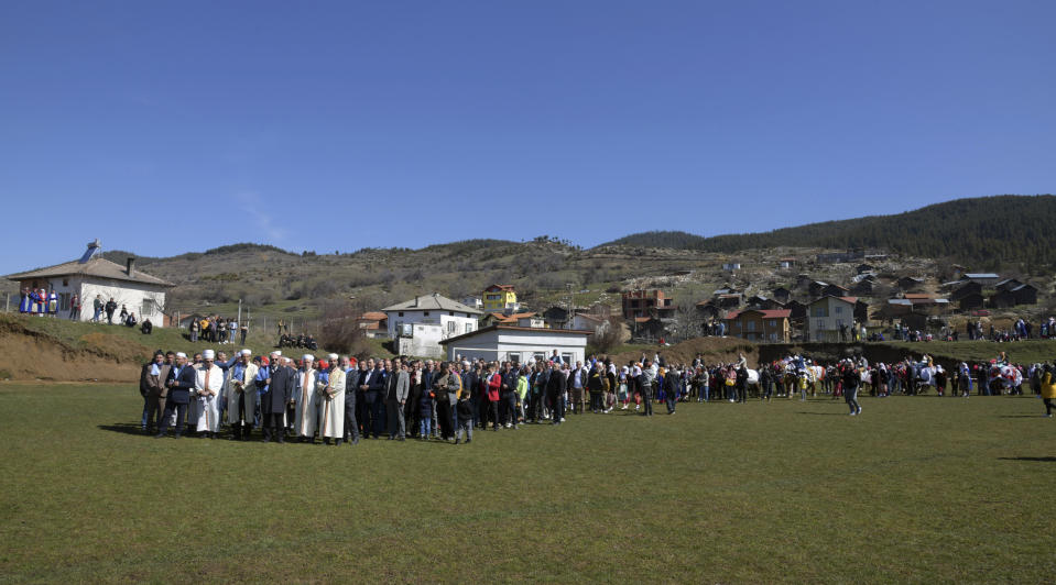 Imams lead the procession during mass circumcision ceremony in the village of Ribnovo, Bulgaria, Sunday, April 11, 2021. Despite the dangers associated with COVID-19 and government calls to avoid large gatherings, Hundreds of people flocked to the tiny village of Ribnovo in southwestern Bulgaria for a four-day festival of feasting, music and the ritual of circumcision which is considered by Muslims a religious duty and essential part of a man's identity. (AP Photo/Jordan Simeonov)