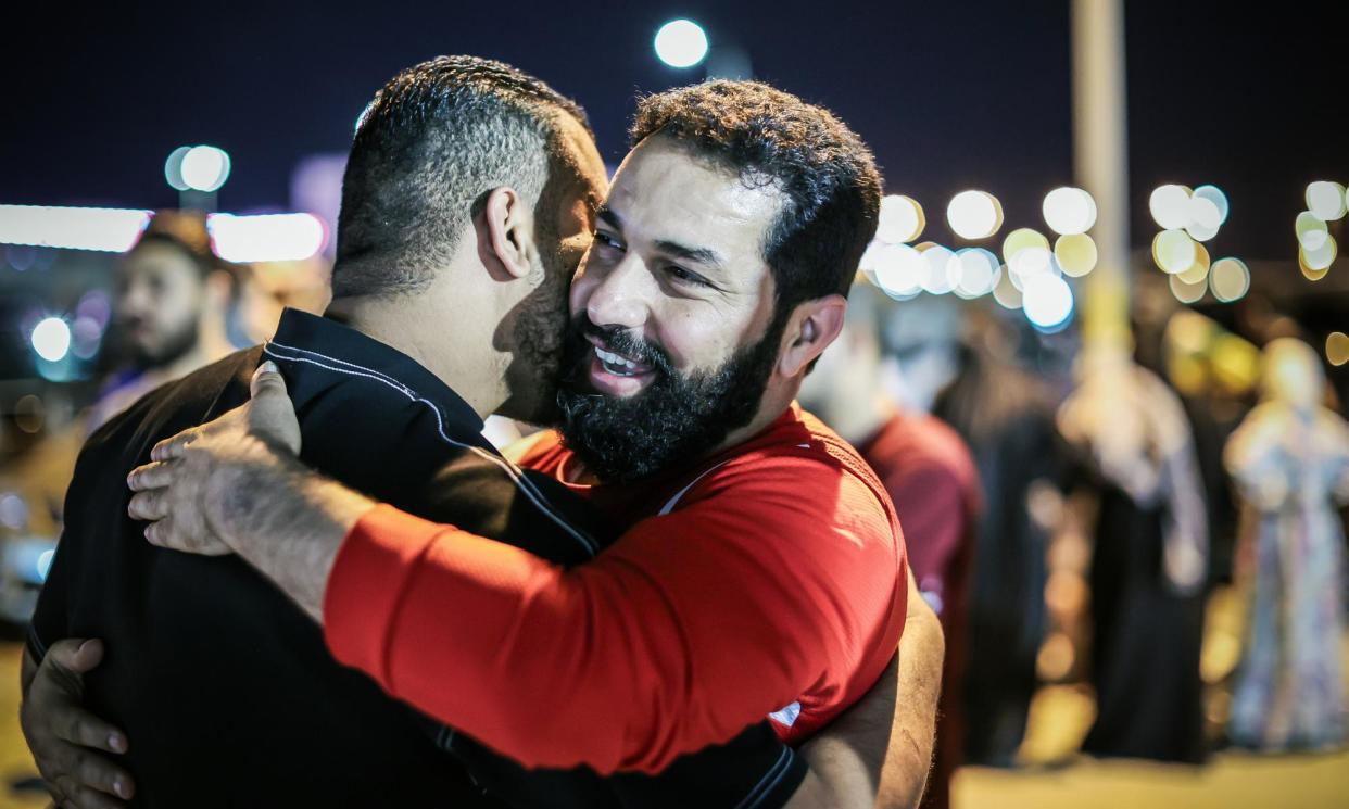 <span>Families gathered in the southern Bahraini city of Hamad to welcome their freed relatives on 8 April.</span><span>Photograph: Anadolu/Getty Images</span>