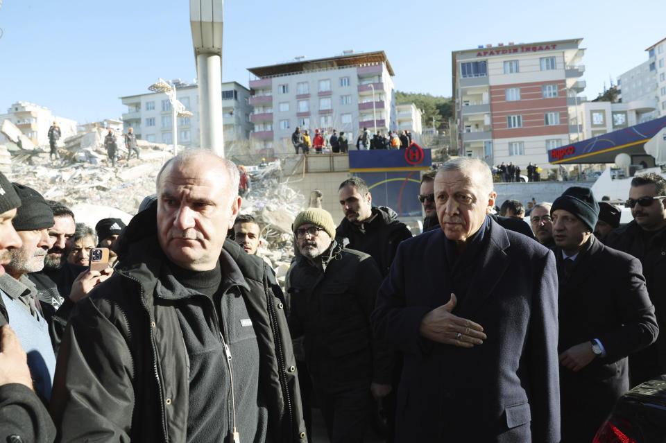 FILE - Turkey's President Recep Tayyip Erdogan visits the city center destroyed by Monday earthquake in Kahramanmaras, southern Turkey, Wednesday, Feb. 8, 2023. Turkish President Recep Tayyip Erdogan came to power 20 years ago riding a wave of public outrage toward the previous government's handling of a deadly earthquake. Now, three months away from an election, Erdogan's political future hinges on how the public perceives his government's response to a similarly devastating natural disaster. (Turkish Presidency via AP, File)