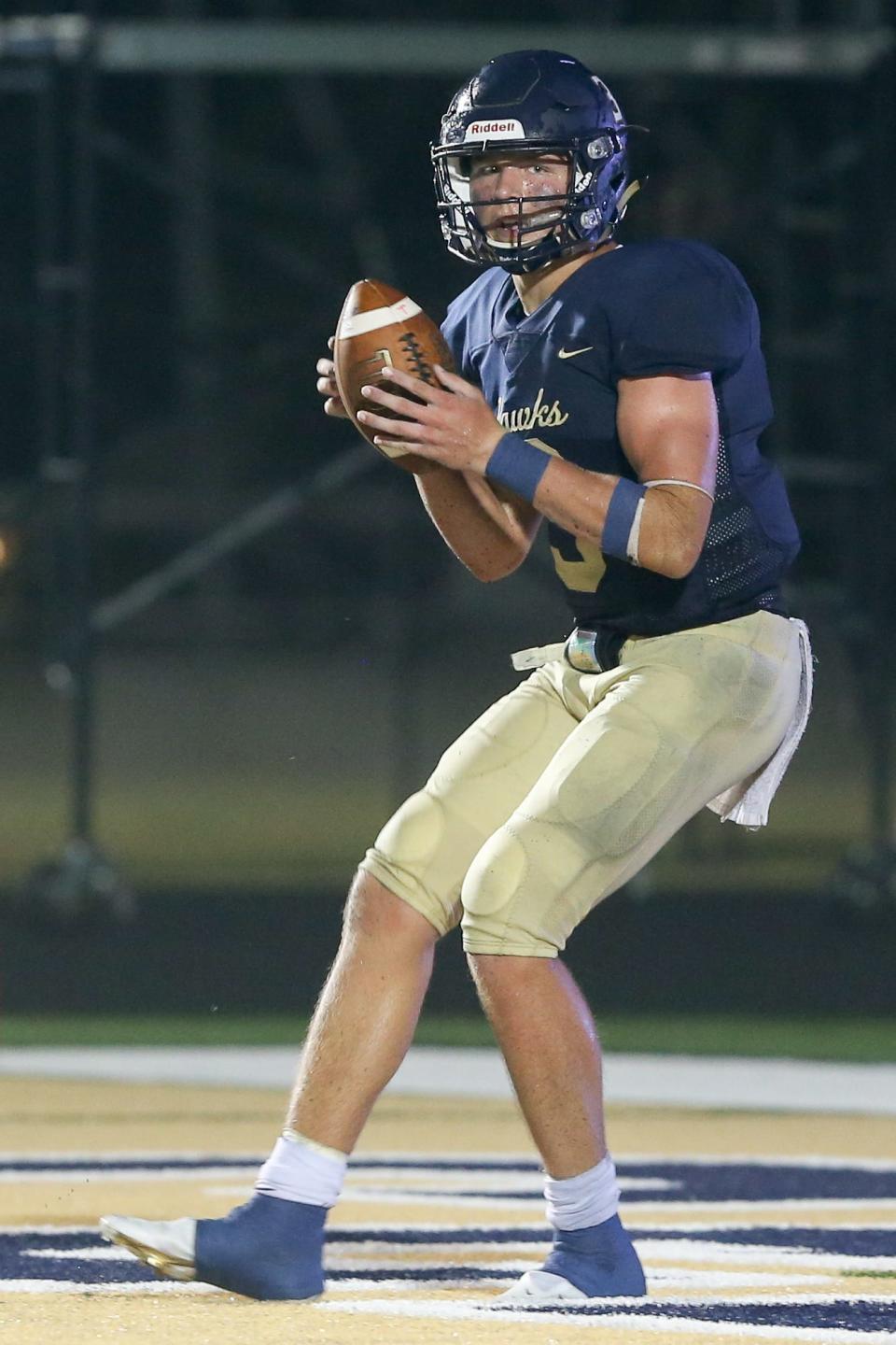 Decatur's Aycen Stevens (3) looking for an open receiver during the Decatur Central vs New Palestine IHSAA varsity boy's football held at Decatur Central High School, Indianapolis, Indiana on August 20, 2021.