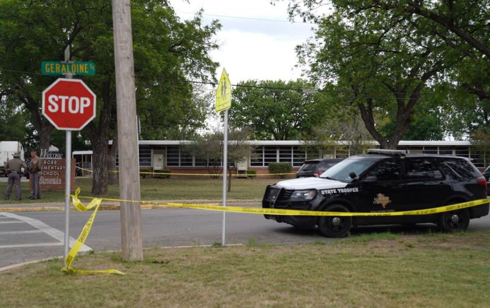Sheriff crime scene tape is seen outside of Robb Elementary School as State troopers guard the area in Uvalde, Texas, on May 24, 2022. (AFP via Getty Images)