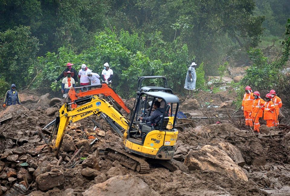 Rescue workers search for missing people after a massive landslide on August  9, 2020 swept away dozens of tea estate workers in Pettimudy, Idukki, Kerala  (Photo by STR / AFP) (Photo by STR/AFP via Getty Images)