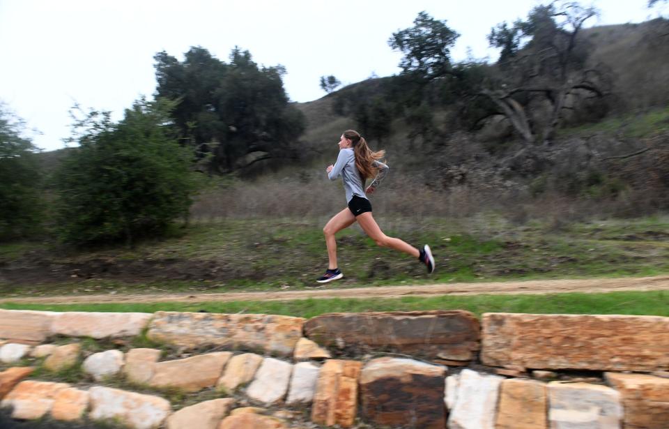 Oaks Christian School's Payton Godsey shows her running form Cheeseboro Canyon Trail in Agoura Hills on Thursday, Dec. 15, 2022. Godsey earned The Star's Girls Runner of the Year honors after winning individual titles at step of her junior season.