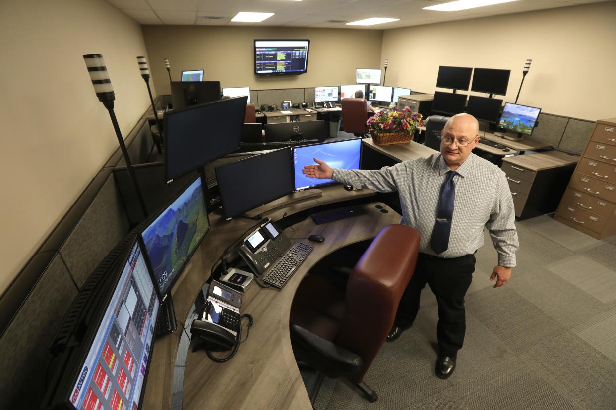 Zanesville Police Department Captain Chris Phipps explains some of the equipment in the city's new dispatch center. The city seeks to hire four more dispatchers.