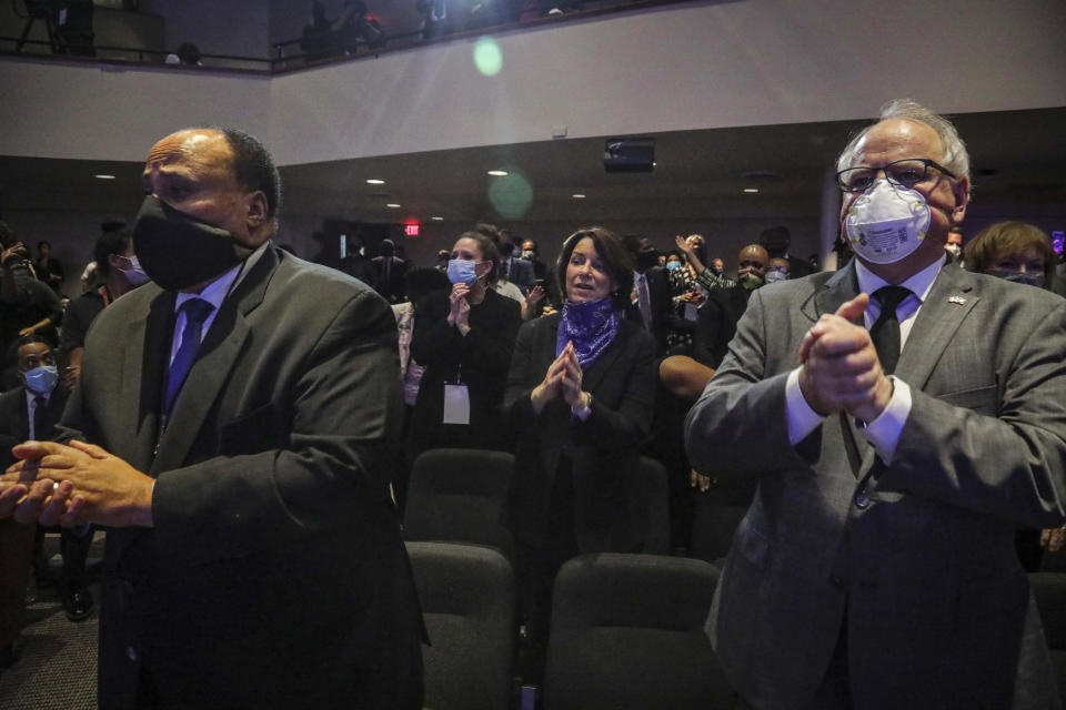 Martin Luther King III, left, U.S. Sen. Amy Klobuchar, second row center, and Minnesota Gov. Tim Walz, right, sing and clap during a memorial service for George Floyd at North Central University, Thursday, June 4, 2020, in Minneapolis. Floyd died on May 25 as a Minneapolis police officer pressed his knee into his neck, ignoring his cries and bystander shouts until he eventually stopped moving. (AP Photo/Bebeto Matthews)