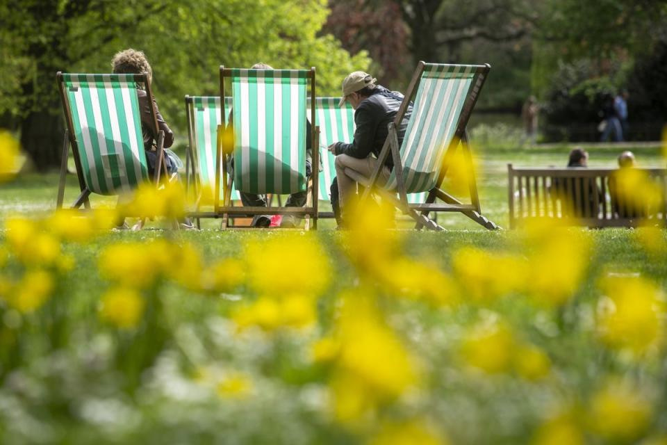 People make use of deckchairs at St James’s Park in central London (PA Wire)
