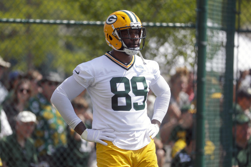 FILE - In this July 25, 2019, file photo, Green Bay Packers' Marcedes Lewis runs a drill during NFL football training camp in Green Bay, Wis. Reporters from The Associated Press spoke to more than two dozen athletes from around the globe -- representing seven countries and 11 sports -- to get a sense of how concerned or confident they are about resuming competition. (AP Photo/Morry Gash, File)