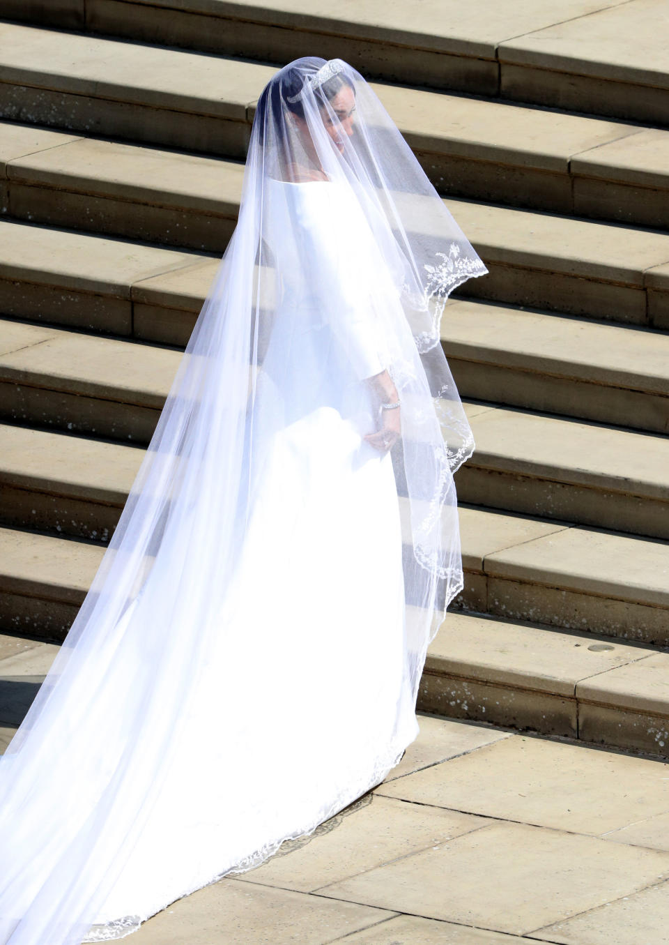 Meghan Markle arrives for the wedding ceremony to marry Britain's Prince Harry, Duke of Sussex, at St George's Chapel, Windsor Castle, in Windsor, on May 19, 2018. (Photo by Andrew Matthews / POOL / AFP)        (Photo credit should read ANDREW MATTHEWS/AFP via Getty Images)