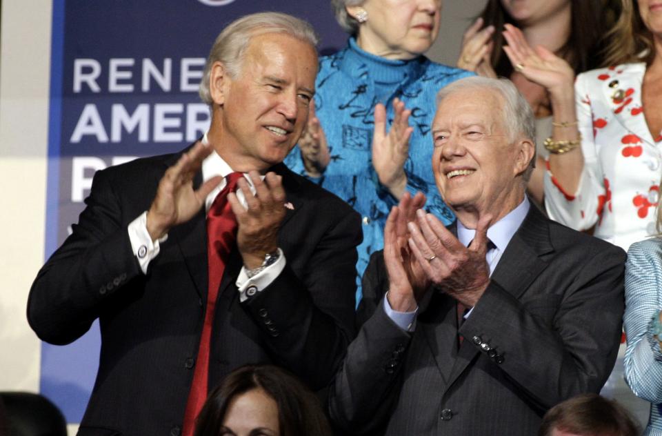 Former President Jimmy Carter, right, is seen with Democratic vice presidential candidate Sen. Joe Biden, D-Del., at the Democratic National Convention in Denver, Tuesday, Aug. 26, 2008.