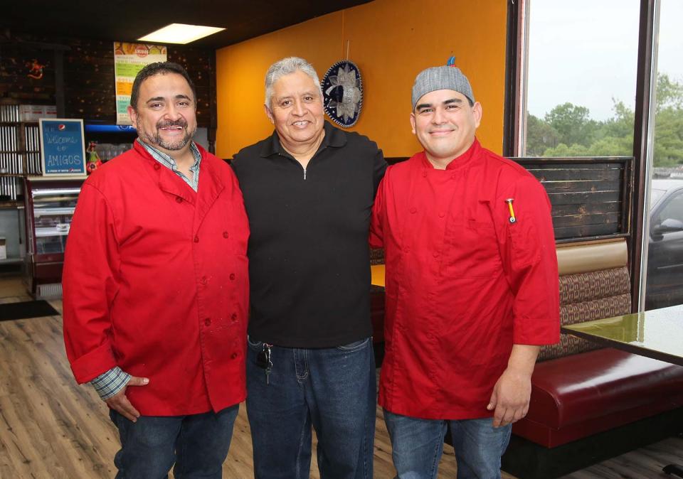 Gustavo Munoz, left, his father, Gilberto Valadez, and his business partner, Alejandro Enriquez, at their new restaurant, Amigos Taqueria in Stow.