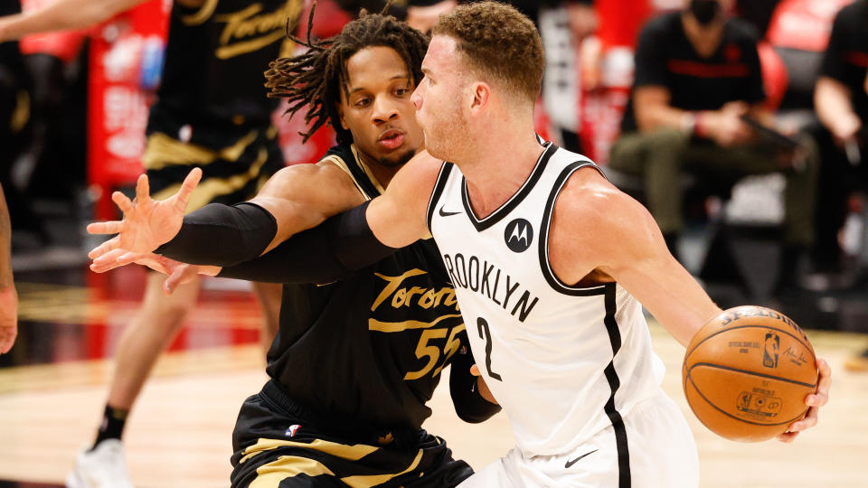 Apr 27, 2021; Tampa, Florida, USA;  aToronto Raptors forward Freddie Gillespie (55) atempts to steal the ball from Brooklyn Nets forward Blake Griffin (2) in the third quarter at Amalie Arena. Mandatory Credit: Nathan Ray Seebeck-USA TODAY Sports - 15975407